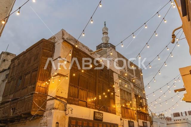 Middle East, Saudi Arabia, Mecca, Jeddah, Al-Balad. Lights strung across the street near the Al Shafei Mosque in the Al Balad historical district.