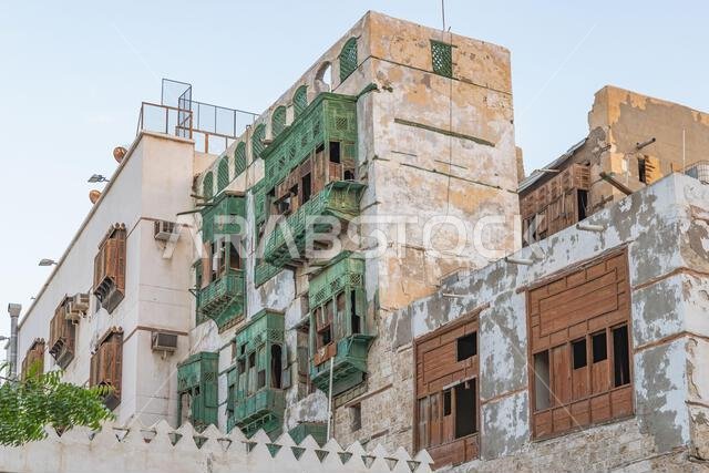 Middle East, Saudi Arabia, Mecca, Jeddah, Al-Balad. Traditional Hijazi tower house with wooden Rosan windows and balconies.