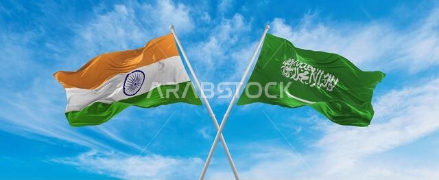 تتقاطع أعلام الهند والسعودية الوطنية وترفرف في مهب الريح تحت سماء ملبدة بالغيوم. ترمز إلى العلاقة والحوار والسفر بين دولتين. تتقاطع أعلام الهند والسعودية الوطنية وترفرف في مهب الريح تحت سماء ملبدة بالغيوم. ترمز إلى العلاقة والحوار والسفر بين دولتين.