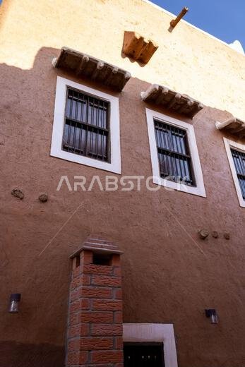 Fragment of the exterior of the restored traditional Arab mud brick house in Ushaiqer, Saudi Arabia
