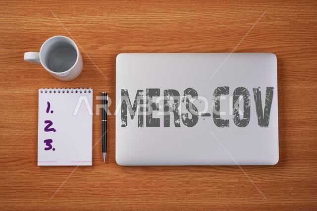 Sign displaying Mers Cov. Business showcase viral respiratory illness that first reported Saudi Arabia Closed Laptop Beside Empty Journal With Pen And