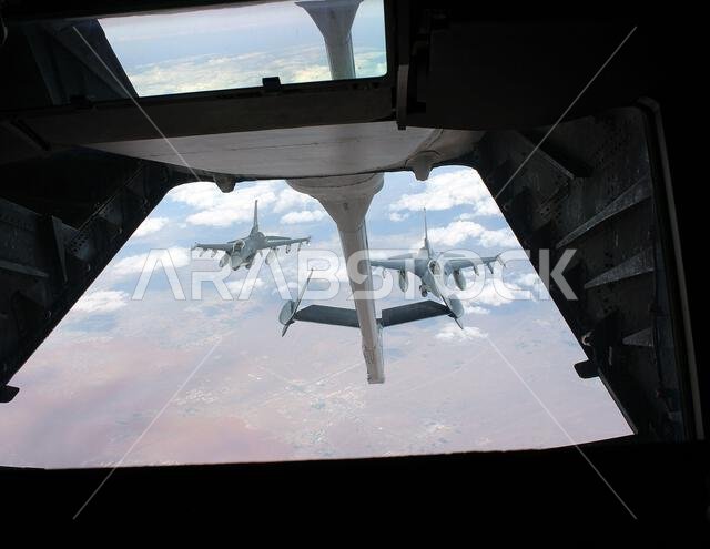 Two F-16 Falcons from the 176thth Expeditionary Fighter Squadron, 378th Air Expeditionary Wing at Prince Sultan Air Base, Saudi Arabia, flying in formation after taking on fuel from a KC-10 Extender, flown by the 908th Air Refueling Squadron, 380th Air Expeditionary Wing, based at Al Dhafra Air Base, United Arab Emirates, Dec. 16, 2021. The KC-10 provides in-air refueling capability to U.S. and allied aircraft throughout the Central Command region. (U.S. Air Force photo by Master Sgt. Dan Heaton
