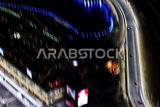 Jeddah, Saudi Arabia. 03rd Dec, 2021. Lance Stroll (CDN) Aston Martin F1 Team AMR21 leads Max Verstappen (NLD) Red Bull Racing RB16B and Sergio Perez (MEX) Red Bull Racing RB16B. Saudi Arabian Grand Prix, Friday 3rd December 2021. Jeddah, Saudi Arabia. Credit: James Moy/Alamy Live News