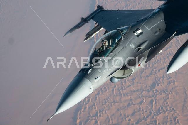 A U.S. Air Force F-16 Fighting Falcon flies above the Kingdom of Saudi Arabia, Nov. 6, 2021. The F-16 is a compact, multi-role fighter aircraft that delivers airpower and showcases U.S. Air Forces Central’s commitment to deterrence and stability in the U.S. Central Command area of responsibility. (U.S. Air Force photo by Staff Sgt. Joseph Pick) A U.S. Air Force F-16 Fighting Falcon flies above the Kingdom of Saudi Arabia, Nov. 6, 2021. The F-16 is a compact, multi-role fighter aircraft that delivers airpower and showcases U.S. Air Forces Central’s commitment to deterrence and stability in the U.S. Central Command area of responsibility. (U.S. Air Force photo by Staff Sgt. Joseph Pick)