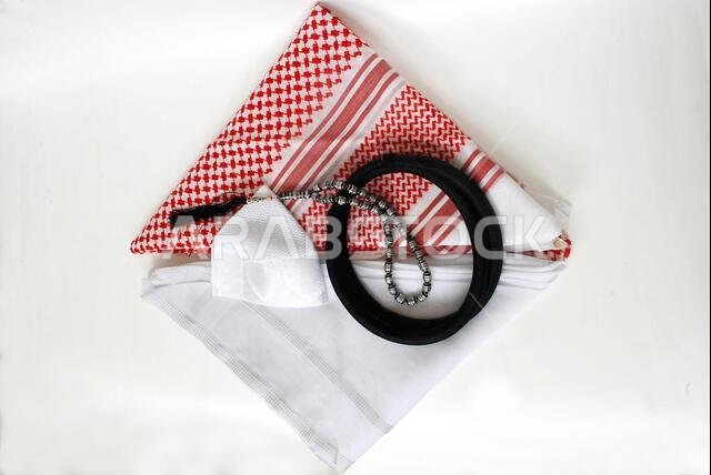 Arabic traditional clothing accessories Agal, Islamic cap and rosary,Shemagh with white Ghutrah isolated on white background