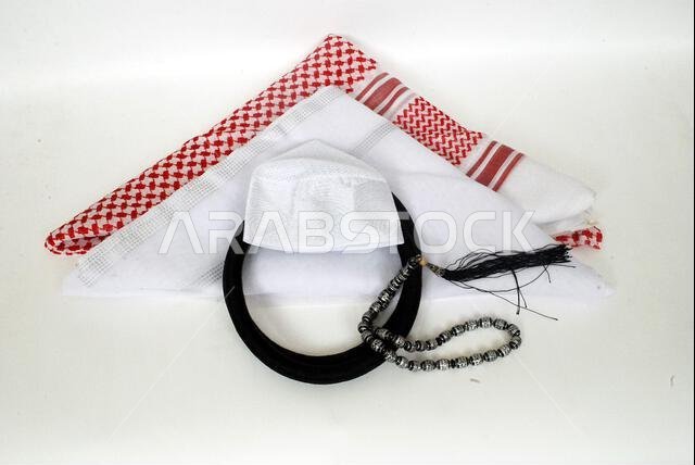 Arabic traditional clothing accessories Agal, Islamic cap and rosary,Shemagh with white Ghutrah isolated on white background