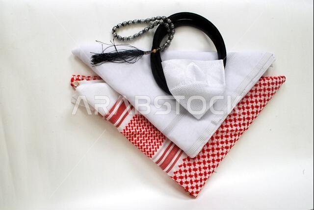 Arabic traditional clothing accessories Agal, Islamic cap and rosary,Shemagh with white Ghutrah isolated on white background