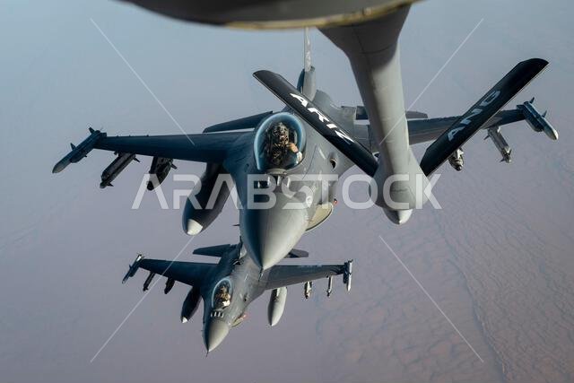 U.S. Air Force F-16 Fighting Falcons approach a U.S. Air Force KC-135 Stratotanker to conduct aerial refueling operations above the Kingdom of Saudi Arabia, Oct. 22, 2021. The F-16 is a compact, multi-role fighter aircraft that delivers war- winning airpower to the U.S. Central Command area of responsibility. (U.S. Air Force photo by Staff Sgt. Joseph Pick)