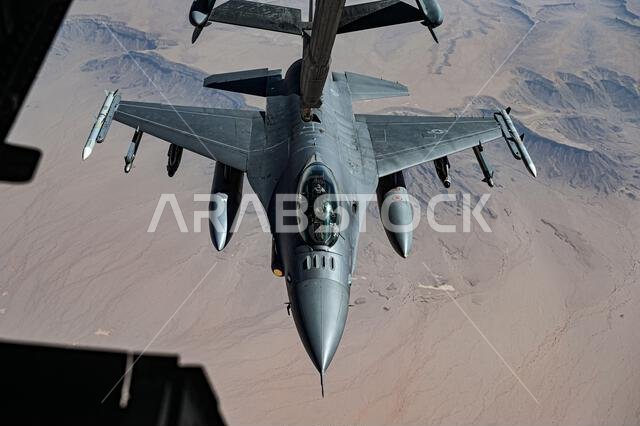 A U.S. Air Force F-16 Fighting Falcon connects with a USAF KC-10 Extender over the Kingdom of Saudi Arabia, Nov. 11, 2021. The F-16 is a compact, multi-role fighter aircraft that delivers war-winning airpower to the U.S. Central Command area of responsibility. (U.S. Air Force photo by Staff Sgt. Jerreht Harris) A U.S. Air Force F-16 Fighting Falcon connects with a USAF KC-10 Extender over the Kingdom of Saudi Arabia, Nov. 11, 2021. The F-16 is a compact, multi-role fighter aircraft that delivers war-winning airpower to the U.S. Central Command area of responsibility. (U.S. Air Force photo by Staff Sgt. Jerreht Harris)
