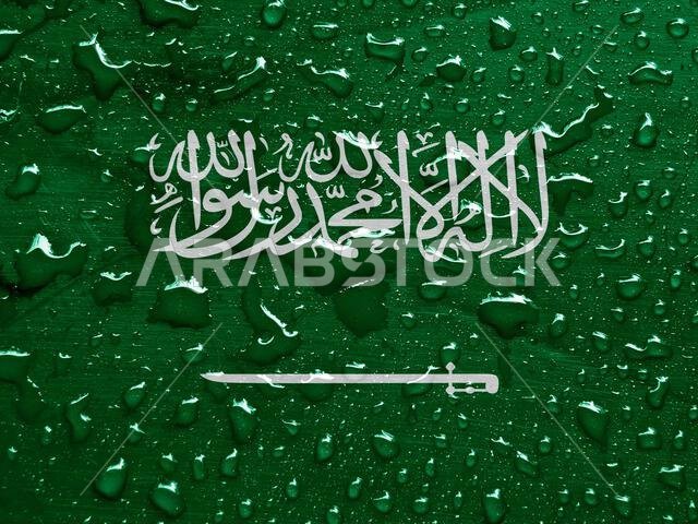 علم المملكة العربية السعودية مع قطرات المطر