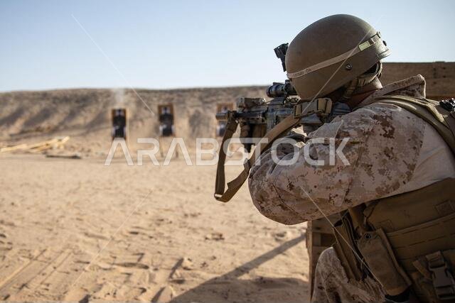 A U.S. Marine with 2nd Battalion, 1st Marine Regiment, assigned to Special Purpose Marine Air-Ground Task Force – Crisis Response – Central Command (SPMAGTF-CR-CC), fires an M27 Infantry Automatic Rifle at a target during a Combat Marksmanship Program (CMP) range in the Kingdom of Saudi Arabia, June 26, 2021. The CMP range allows Marines to maintain rifle and machine gun proficiency while being put through various courses of fire. The SPMAGTF-CR-CC is a crisis response force, prepared to deploy 