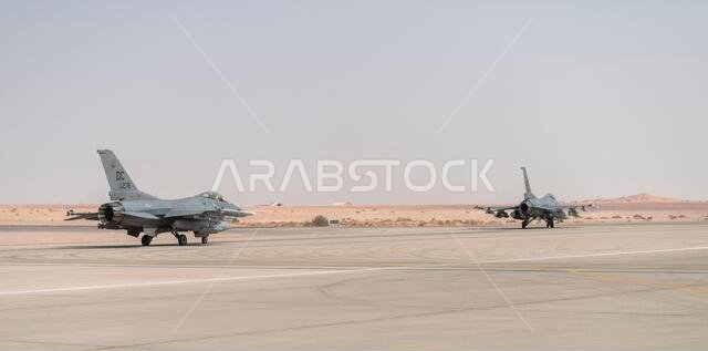 طائرتان من طراز إف-16 فايتينغ فالكون تستعدان للإقلاع إلى أفغانستان من قاعدة الأمير سلطان الجوية، المملكة العربية السعودية، في 27 أغسطس/آب 2021. بالإضافة إلى الدعم اللوجستي والبشري، قدم الجناح الجوي الاستكشافي 378 قوة جوية قتالية لضمان التفوق الجوي للقيادة المركزية الأمريكية خلال عمليات إجلاء المدنيين في أفغانستان. (صورة من سلاح الجو الأمريكي، بعدسة الرقيب أول كاليب بافاو) طائرتان من طراز إف-16 فايتينغ فالكون تستعدان للإقلاع إلى أفغانستان من قاعدة الأمير سلطان الجوية، المملكة العربية السعودية، في 27 أغسطس/آب 2021. بالإضافة إلى الدعم اللوجستي والبشري، قدم الجناح الجوي الاستكشافي 378 قوة جوية قتالية لضمان التفوق الجوي للقيادة المركزية الأمريكية خلال عمليات إجلاء المدنيين في أفغانستان. (صورة من سلاح الجو الأمريكي، بعدسة الرقيب أول كاليب بافاو)
