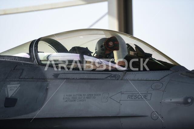 A pilot with the 77th Expeditionary Fighter Squadron, prepares for a sortie in a F-16C Fighting Falcon Feb. 2, 2021, at King Faisal Air Base, Kingdom of Saudi Arabia. The 77th EFS along with a contingent of maintenance personnel from the 77th Fighter Generation Squadron, conducted a two-day training exercise with the Royal Saudi Air Force to capitalize on each other’s strengths while bolstering interoperability. Integrating with the host nation in locations throughout the country amplifies the 3 A pilot with the 77th Expeditionary Fighter Squadron, prepares for a sortie in a F-16C Fighting Falcon Feb. 2, 2021, at King Faisal Air Base, Kingdom of Saudi Arabia. The 77th EFS along with a contingent of maintenance personnel from the 77th Fighter Generation Squadron, conducted a two-day training exercise with the Royal Saudi Air Force to capitalize on each other’s strengths while bolstering interoperability. Integrating with the host nation in locations throughout the country amplifies the 3