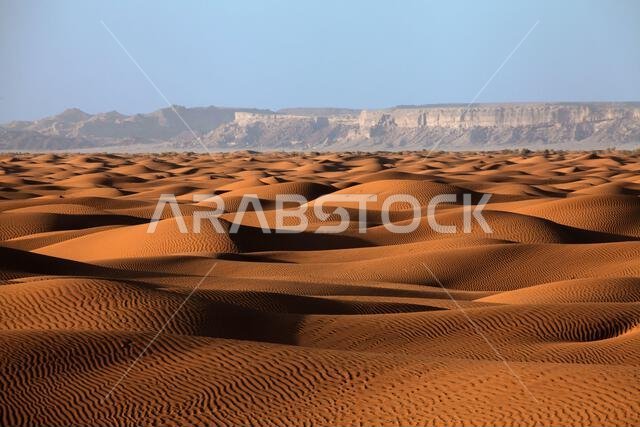 Sand dunes and mountain landscape in the desert, Saudi Arabia
