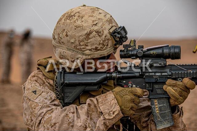 A U.S. Marine with 3rd Battalion, 1st Marines, assigned to the Special Purpose Marine-Air Ground Task Force – Crisis Response - Central Command engages his target during a live-fire squad assault range during exercise Falcon Claw III in the Kingdom of Saudi Arabia, Mar. 22, 2021. Falcon Claw is a subject matter expert exchange that enhances interoperability and strengthens military-to-military relationships between U.S. and Saudi Arabian forces. A U.S. Marine with 3rd Battalion, 1st Marines, assigned to the Special Purpose Marine-Air Ground Task Force – Crisis Response - Central Command engages his target during a live-fire squad assault range during exercise Falcon Claw III in the Kingdom of Saudi Arabia, Mar. 22, 2021. Falcon Claw is a subject matter expert exchange that enhances interoperability and strengthens military-to-military relationships between U.S. and Saudi Arabian forces.