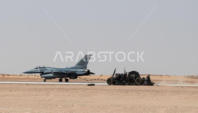 A 77th Expeditionary Fighter Squadron pilot tests an arrest cable March 31, 2021, at Prince Sultan Air Base, Kingdom of Saudi Arabia. Members of the 378th Expeditionary Operation Support Squadron, Expeditionary Civil Engineer Squadron and Expeditionary Maintenance Squadron performed the test to certify the use of the arrest cable, a mechanical system used in an emergency landing to quickly decelerate aircraft. The certification was part of ongoing efforts at PSAB to bolster redundancy and resili A 77th Expeditionary Fighter Squadron pilot tests an arrest cable March 31, 2021, at Prince Sultan Air Base, Kingdom of Saudi Arabia. Members of the 378th Expeditionary Operation Support Squadron, Expeditionary Civil Engineer Squadron and Expeditionary Maintenance Squadron performed the test to certify the use of the arrest cable, a mechanical system used in an emergency landing to quickly decelerate aircraft. The certification was part of ongoing efforts at PSAB to bolster redundancy and resili