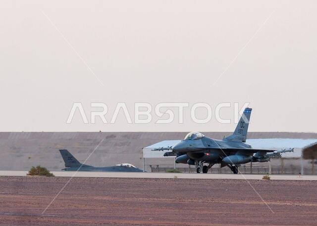 Two U.S Air Force F-16 Fighting Falcons taxi to the runway at Prince Sultan Air Base, Kingdom of Saudi Arabia, in preparation for combat air patrol sorties in the U.S. Central Command area of responsibility Aug. 16, 2021. The 378th Air Expeditionary Wing is providing air support, logistical capabilities, manpower and resources to U.S. Air Forces Central in support of non-combatant evacuation operations in Afghanistan. (U.S. Air Force photo by Senior Airman Samuel Earick)