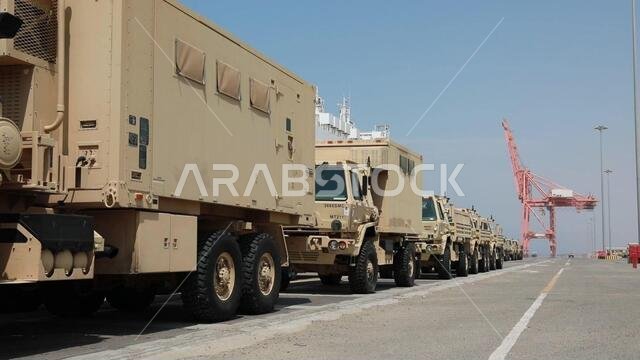 Military vehicles are stationed in a row after offload from the Liberty Peace cargo vessel at the industrial port of Yanbu, Kingdom of Saudi Arabia April 20, 2021. They will be transported back to Kuwait as part of logistics Exercise, LOGEX21. The military vehicles included the M2/A2 Bradley Fighting Vehicle, Light Medium Tactical Vehicles (LMTV), and the High Mobility Multipurpose Wheeled Vehicle (HMMWV). LOGEX 21 demonstrates the 1st Theater Sustainment Command’s readiness and ability to provi Military vehicles are stationed in a row after offload from the Liberty Peace cargo vessel at the industrial port of Yanbu, Kingdom of Saudi Arabia April 20, 2021. They will be transported back to Kuwait as part of logistics Exercise, LOGEX21. The military vehicles included the M2/A2 Bradley Fighting Vehicle, Light Medium Tactical Vehicles (LMTV), and the High Mobility Multipurpose Wheeled Vehicle (HMMWV). LOGEX 21 demonstrates the 1st Theater Sustainment Command’s readiness and ability to provi