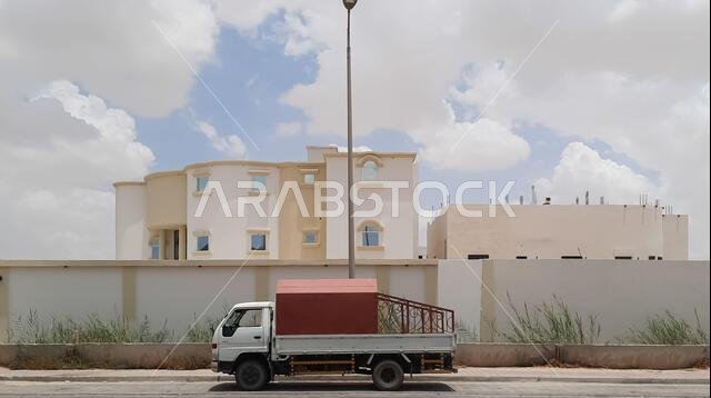 HOFUF AL HASA, SAUDI ARABIA - Aug 18, 2021: A street and buildings of Al Hofuf in Saudi Arabia