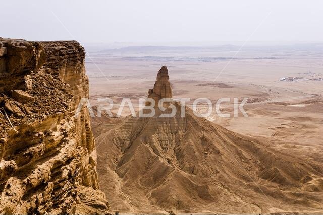 The Faisal's Finger rock near Riyadh, Saudi Arabia, a view from Jabal Tuwaiq escarpment.