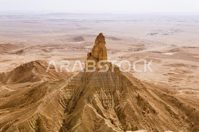 The Faisal's Finger rock near Riyadh, Saudi Arabia, a view from Jabal Tuwaiq escarpment.