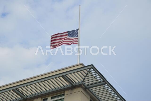 9/11 - The American flag flying at half-staff at the American embassy in Berlin, Germany - September 11, 2021.