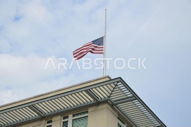 9/11 - The American flag flying at half-staff at the American embassy in Berlin, Germany - September 11, 2021.
