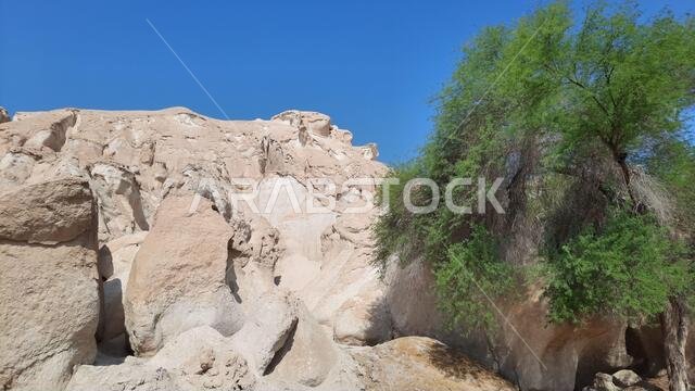 H, SAUDI ARABIA - Aug 20, 2021: The beautiful Al Qarah Mountains, in Al Hofuf, Saudi Arabia during daylight