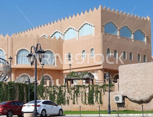 HOFUF AL HASA, SAUDI ARABIA - Aug 20, 2021: The hotels near Al Qarah Mountains, in Al Hofuf, Saudi Arabia during daylight