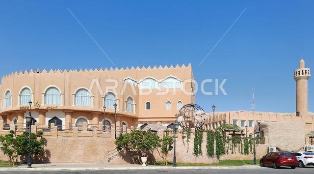HOFUF AL HASA, SAUDI ARABIA - Aug 20, 2021: The hotels near Al Qarah Mountains, in Al Hofuf, Saudi Arabia during daylight