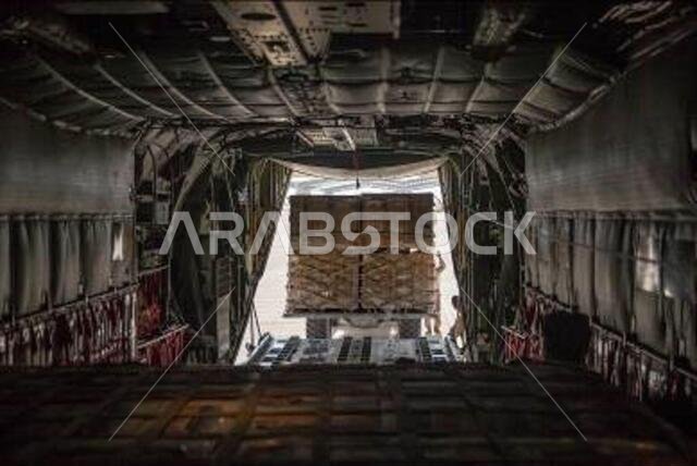 U.S. Marines assigned to the Special Purpose Marine Air-Ground Task Force – Crisis Response – Central Command, load pallets of water and MREs onto a KC-130J Super Hercules in the Kingdom of Saudi Arabia, Aug. 22, 2021. The supplies are being flown to resupply the Marines who are assisting in the evacuation at Hamid Karzai International Airport, Kabul, Afghanistan.