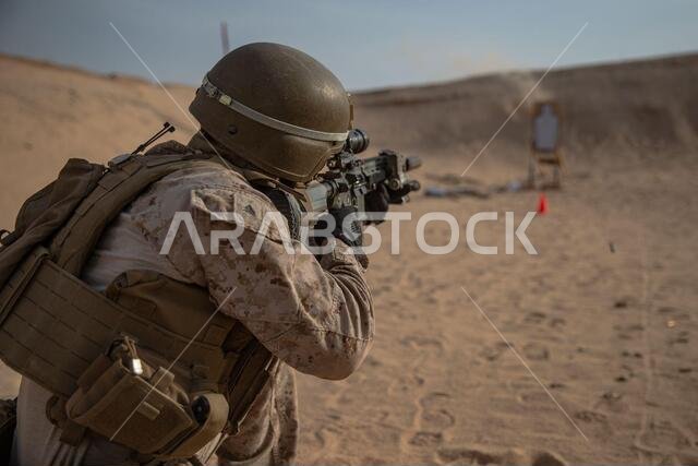 A U.S. Marine with 2nd Battalion, 1st Marine Regiment, assigned to Special Purpose Marine Air-Ground Task Force – Crisis Response – Central Command (SPMAGTF-CR-CC), fires an M27 Infantry Automatic Rifle at a target during a Combat Marksmanship Program (CMP) range in the Kingdom of Saudi Arabia, July 10, 2021. The CMP range allows Marines to maintain rifle proficiency while being put through various courses of fire. The SPMAGTF-CR-CC is a crisis response force, prepared to deploy a variety of cap A U.S. Marine with 2nd Battalion, 1st Marine Regiment, assigned to Special Purpose Marine Air-Ground Task Force – Crisis Response – Central Command (SPMAGTF-CR-CC), fires an M27 Infantry Automatic Rifle at a target during a Combat Marksmanship Program (CMP) range in the Kingdom of Saudi Arabia, July 10, 2021. The CMP range allows Marines to maintain rifle proficiency while being put through various courses of fire. The SPMAGTF-CR-CC is a crisis response force, prepared to deploy a variety of cap