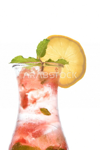 Close-up of a glass of mojito juice with lemon slices, cold drinks, delicious natural juices, healthy and useful juice, refreshing and iced summer drink, delicious mojito drink, white background