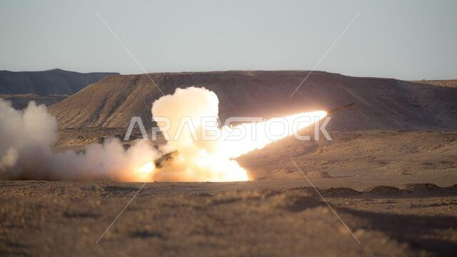 210308-M-JX780-1267 TABUK, Kingdom of Saudi Arabia (March 8, 2021) – A U.S. Marine Corps High Mobility Artillery Rocket System (HIMARS) assigned to HIMARS Detachment, Battalion Landing Team 1/4, 15th Marine Expeditionary Unit (MEU), fires a rocket during a theater amphibious combat rehearsal (TACR) in Tabuk, Kingdom of Saudi Arabia, March 8. TACR integrates U.S. Navy and Marine Corps assets to practice and rehearse a range of critical combat-related capabilities available to U.S. Central Command