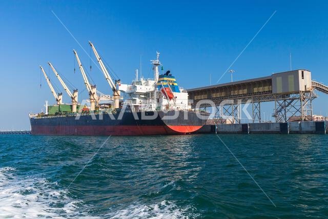 Bulk carrier, cargo ship is loading in port. Saudi Arabia