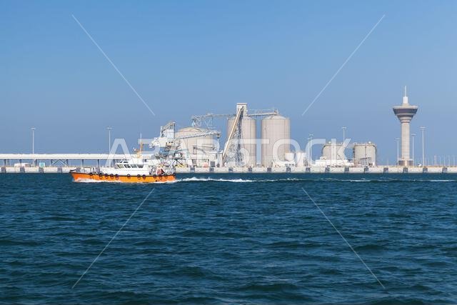 Pilot boat is on the way. Ras Al Khair port is on a background, Saudi Arabia Pilot boat is on the way. Ras Al Khair port is on a background, Saudi Arabia