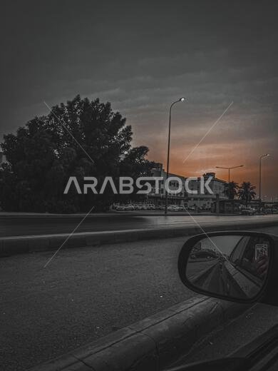 RIYADH, SAUDI ARABIA - Nov 01, 2021: A vertical shot of a sunset taken from a car in Riyadh, Saudi Arabia