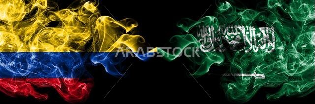 Colombia, Colombian vs Saudi Arabia, Arabian smoky mystic flags placed side by side. Thick colored silky abstract smokes flags.