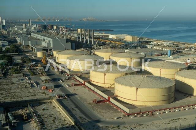 Middle East water and gas containers along the coastline for gas, water and oil concepts. Industrial zone.
