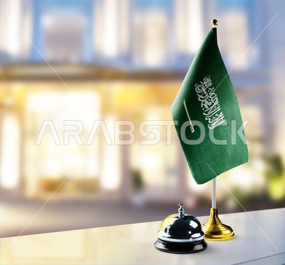 Saudi Arabia flag on the reception desk in the lobby of the hotel Saudi Arabia flag on the reception desk in the lobby of the hotel