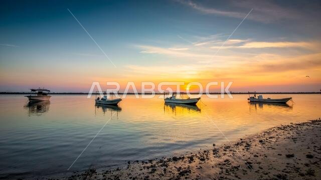 Boats on Dammam sea side with sunrise background view. Dammam, Saudi Arabia.