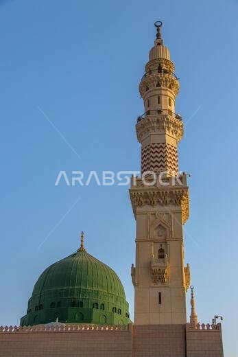 The famous Green Dome and beautiful minaret of Prophet Mosque - Masjid Nabawi in Medina. Islamic buildings