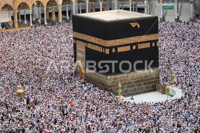 The Holy Kaaba is the center of Islam. Masjid Al Haram in Mecca. Crowd of people always walking around Kaaba. Tawaf
