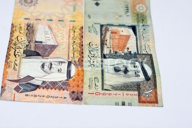 Saudi Arabia ten riyals banknotes with the photo of king Salman bin AbdulAziz and Fortress and the photo of King Abdullah and King Abdulaziz's palace