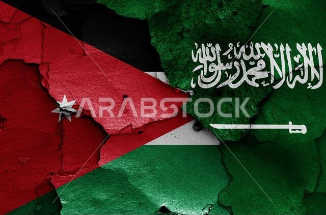 أعلام الأردن والسعودية مرسومة على جدار متصدع أعلام الأردن والسعودية مرسومة على جدار متصدع