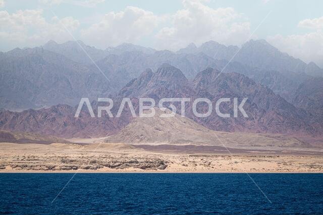 red sea and sinai mountains. incredible landscape sea mountains amazing clouds in the sky. Egypt, Dahab, Sinai Peninsula. Red sea.