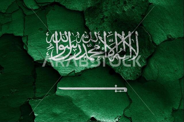 flag of Saudi Arabia painted on cracked wall