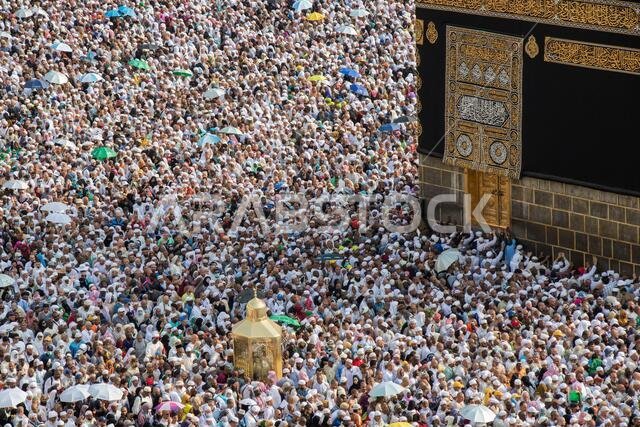 Holy Kaaba and Magam Ibrahim in Mecca. Muslim pilgrims during tawaf. Mecca - Saudi Arabia Holy Kaaba and Magam Ibrahim in Mecca. Muslim pilgrims during tawaf. Mecca - Saudi Arabia
