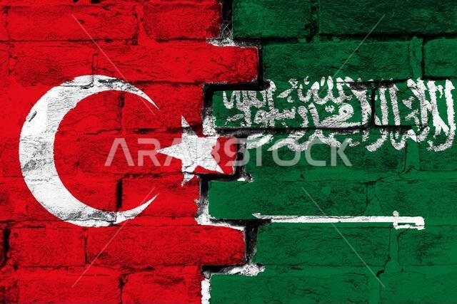 مفهوم العلاقة بين تركيا والمملكة العربية السعودية من خلال علمين مرسومين على جدار من الطوب المتضرر مفهوم العلاقة بين تركيا والمملكة العربية السعودية من خلال علمين مرسومين على جدار من الطوب المتضرر