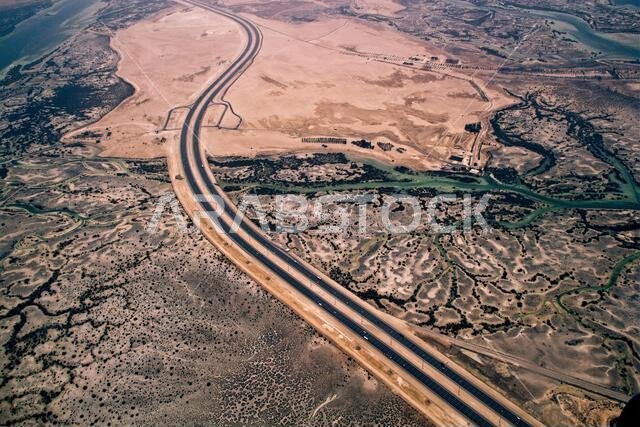 Aerial view of earth, from the top of Dubai showing sea and desert